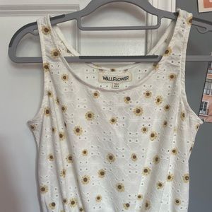 white tank top with yellow flowers; wallflower is the brand